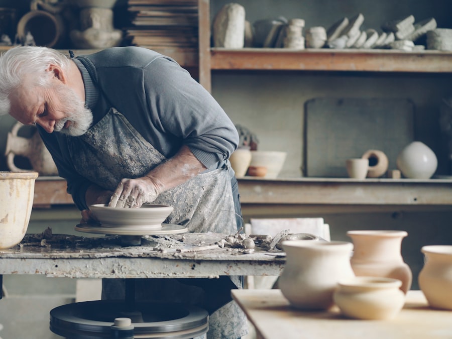 Potter shaping clay on a wheel for the Kiln Nine ceramics shop